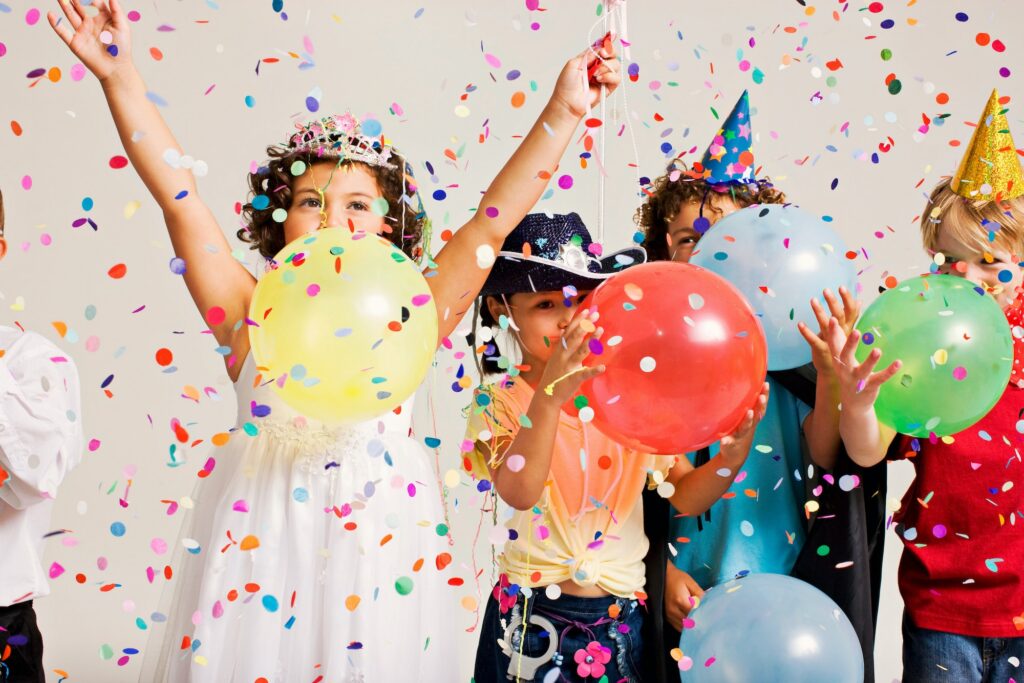 party kids blowing balloons